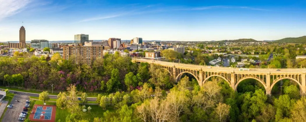 Aerial panorama of city skyline on late sunny afternoon.